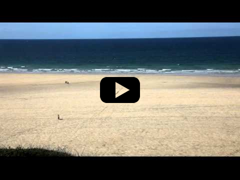 Gwithian beach looking north and a RNLI Lifeguard post