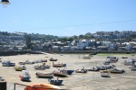 Fishing boats in the harbour with St Ia, the parish church of St Ives on the left